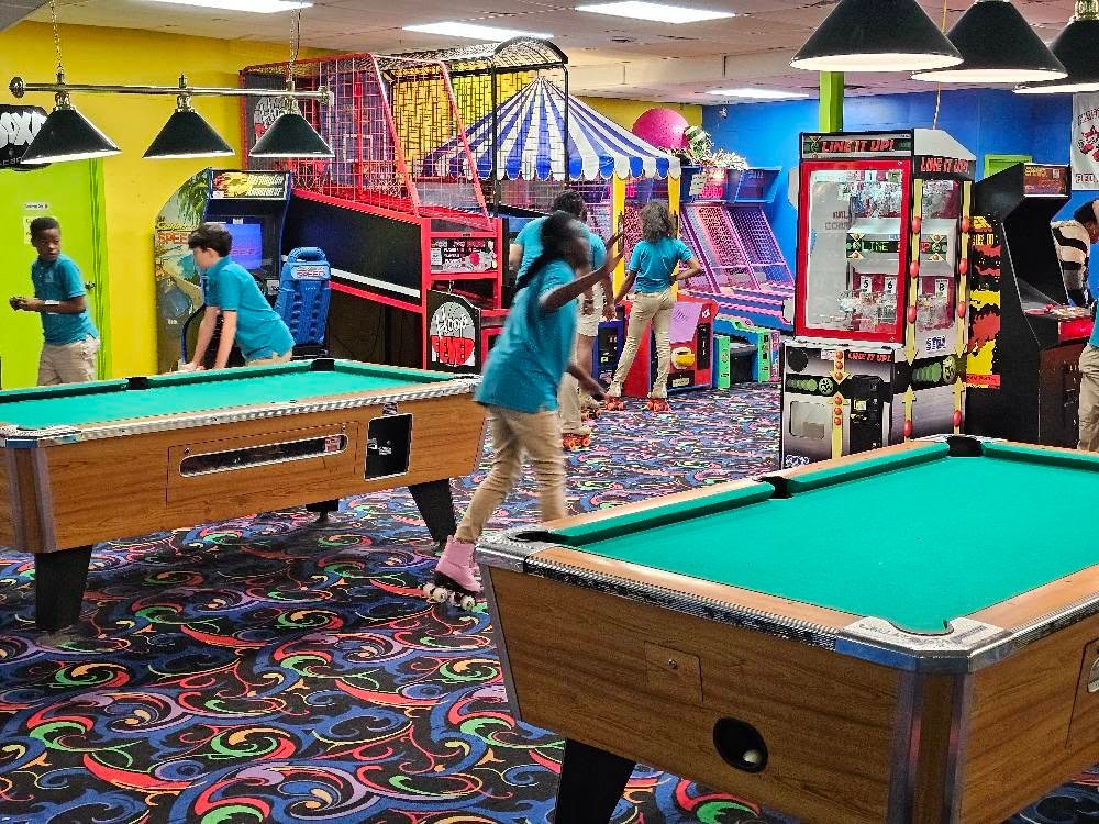 Private party group playing pool and arcade games at Hartsville Skating Arena